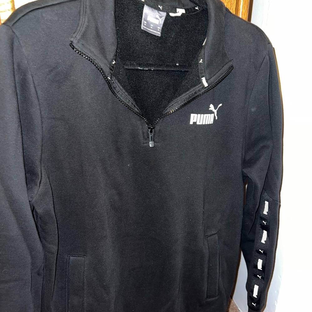 Black puma sweater.